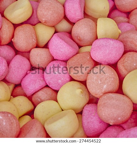 pale pink and yellow candies, sweet background