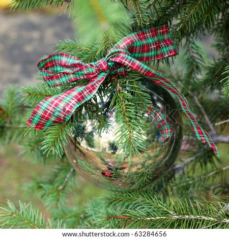 one silver Christmas  ball on fir branch