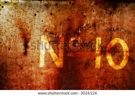 interesting rusting texture worn out numbers on, captured form the side of an old rusting train carriage