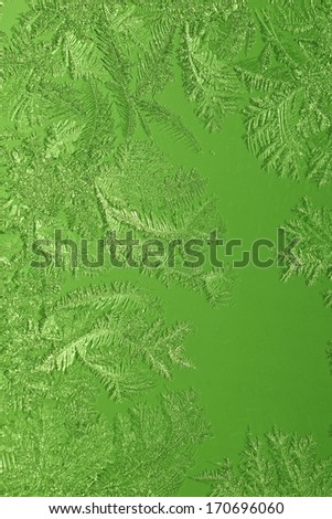 Green ice crystals on the glass (frosted glass)