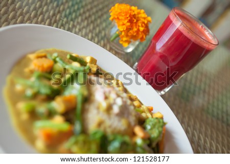 Beautiful vegetarian meal served with fresh juice and decorated with flower