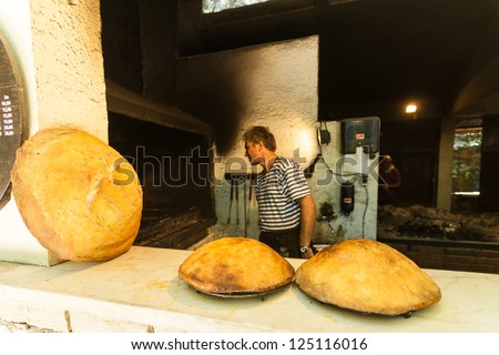 OMIS, CROATIA - AUGUST 28, 2012: Homemade bread in the bakery on August 28, 2012 in Omis, Croatia. Homemade bread baked under the ashes is one of the specialties of Dalmatia.