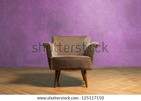 Old chair in grunge room with pink wall
