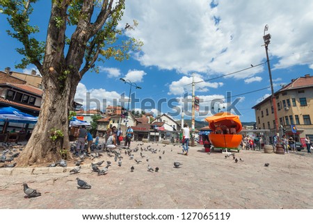 SARAJEVO, BOSNIA - AUGUST 11: Pigeons in pedestrian area of Bascarsija on August 11, 2012 in Sarajevo, Bosnia. Bascarsija, the old town, is a leisurely place for locals and tourists alike.