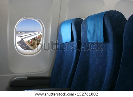 Airplane seat and window inside an aircraft