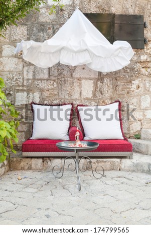 Outdoor seating on cushions in little cafe in Mostar, Bosnia