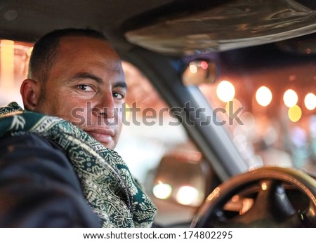 DAHAB, EGYPT - JANUARY 1, 2011: Portrait of the taxi driver. Taxi is favourite transport for western tourists visiting Egypt.