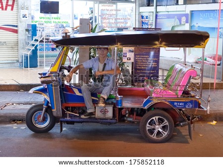 Bangkok, Thailand - January 9, 2012: Local Tuk-Tuk Driver Waits For Customers. Tuk-Tuks Have Become One Of Bangkok\'S Most Recognisable Transportation Features, And Are Still Popular Among Tourists.