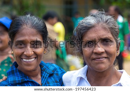 HIKKADUWA, SRI LANKA - FEBRUARY 23, 2014: Portrait of two local women at Sunday market. It is a great way to see Hikkaduwa\'s local life come alive along with fresh produce and local delicacy.