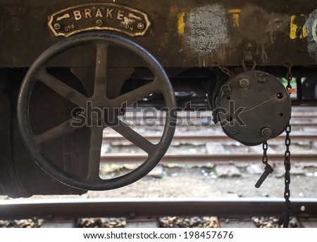 Brake wheel on old rusty train wagon on Nanu Oya train station in Sri Lanka.