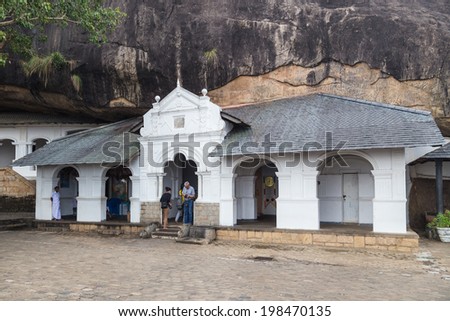 DAMBULLA, SRI LANKA - FEBRUARY 27, 2014: Dambulla cave temple also known as Golden Temple. It is is the largest, best-preserved cave-temple complex in Sri Lanka listed as UNESCO World Heritage site.