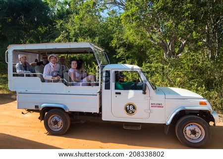 YALA NATIONAL PARK, SRI LANKA - MARCH 4, 2014: Safari jeep tour in the Yala park. Yala is the second largest national park in Sri Lanka.