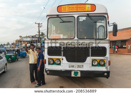GALLE, SRI LANKA - FEBRUARY 22, 2014: Large public transport bus stopped on street. Buses are the Sri Lankan principal mode of public transport.