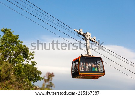 DUBROVNIK, CROATIA - MAY 26, 2014: Tourists in the Dubrovnik cable car. It connects Ploce and  mountain Srdj above town where you can enjoy a panoramic view of Old Town and the surrounding islands.
