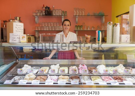 DUBROVNIK, CROATIA - MAY 26, 2014: Young waitress in Dolce vita, popular ice cream and cake shop.