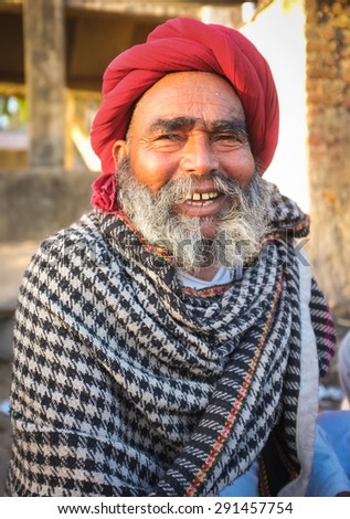 GODWAR REGION, INDIA - 14 FEBRUARY 2015: Elderly Rabari tribesman with red turban and blanket around the shoulders. Rabari or Rewari are an Indian community in the state of Gujarat.