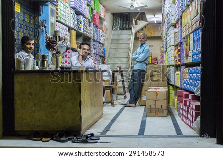 JODHPUR, INDIA - 16 FEBRUARY 2015: Three Indian men in textile store.