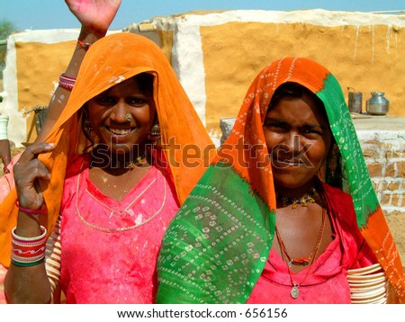 Young Indian women in traditional dress in desert village near Jaisalmer, India
