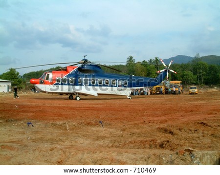emergency helicopter transporting forensic doctors to khao lak, thailand