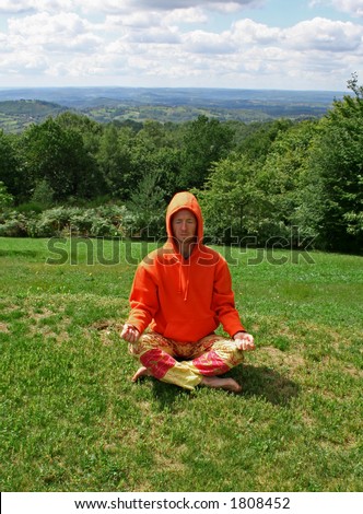 meditating man on hill