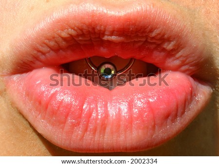 close up of luscious lips with diamond piercing