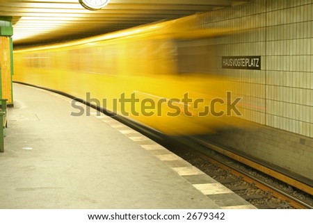 underground train rushing into station