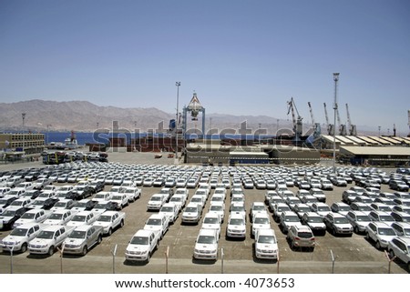 new cars lined up in the port of eilat, israel