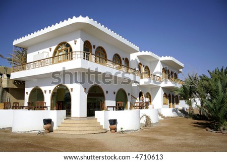 white hotel on the sea front in dahab, red sea, sinai, egypt