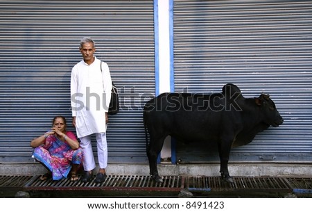 couple waiting outside shop, rishikesh, india