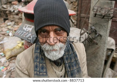 old bearded man on the street, delhi, india