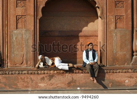Two old men relaxing at Jama Masjid, Delhi, India