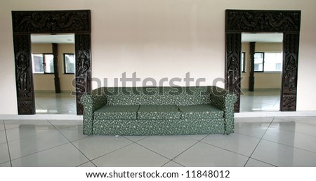 sofa and mirrors in hall of hotel