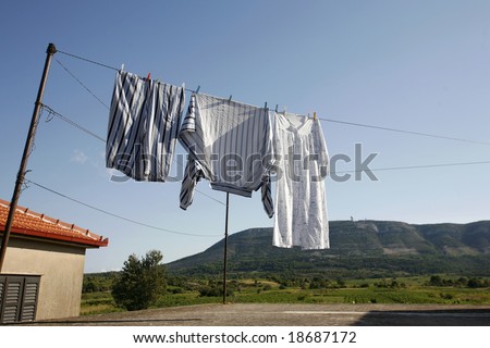 Clothes hanging on the washing line to dry in summer