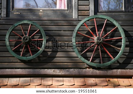 Cart wheel house decoration on wall in Zagreb, Croatia