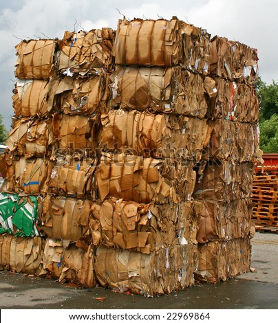stack of paper waste before shredding at recycling plant in Germany