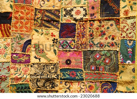 Indian patchwork wall cloth on display in Hampi market, India