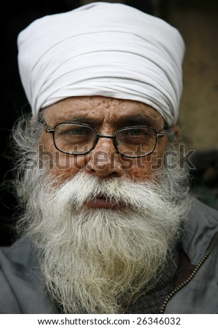 DELHI, INDIA - FEBRUARY 1, 2008 : A portrait of an old white bearded sikh man with turban and spectacles on February 1, 2008 in Delhi, India. Delhi is the second most populous city in India.