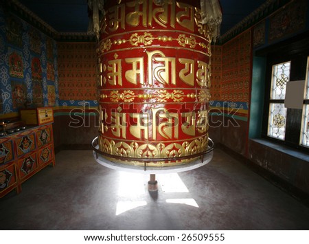 Large praying wheel in small temple on the annapurna circuit.