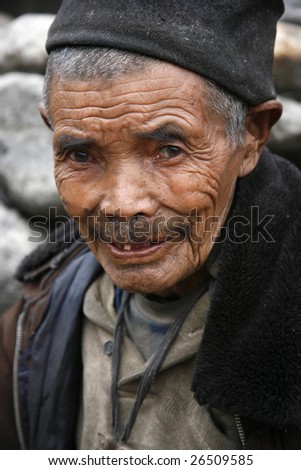 ANNAPURNA, NEPAL - MARCH 20: An unidentified 79-year-old man poses for a portrait in a village on March 20, 2008 in Nepal.