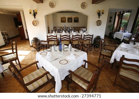 Interior of Italian restaurant with white table cloths
