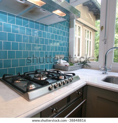 Kitchen Garden Design on Modern Kitchen With Turquoise Tiles On Wall Looking Onto Garden Stock