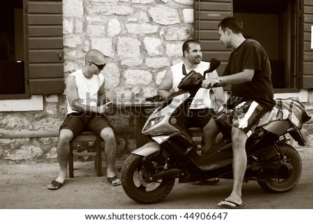 BRAC - AUGUST 13: New generation of Croatian men can finally enjoy peace after the war of Independence against Serbia, August 13, 2009 in Brac, Croatia. Official figures lists 12,000 killed.