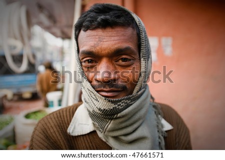 DELHI - JANUARY 31: Portrait of a day labourer January 31, 2008 in Delhi, India. These men sit on the street hoping to get day jobs not paid more than 2,5 dollars a day.