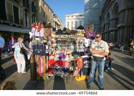 VENICE - OCTOBER 28: Street vendor selling tourist souvenirs on October 28, 2009 in Venice. Most vendors in Venice aren\'t of Italian origin.