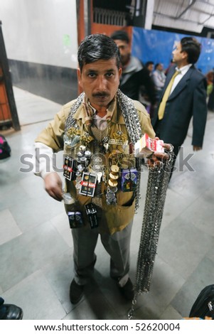 DELHI - FEBRUARY 19: Vendor in train station selling chains and locks to secure luggage during trip on February 19, 2008 in Delhi, India. Thieves are always on the look out on trains.