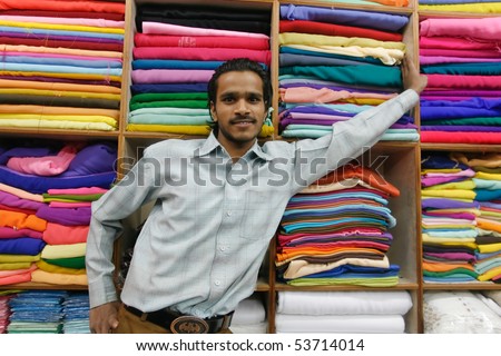 DELHI - JAN 19: Young indian promoting his textile fabrics on January 19, 2008 in Delhi, India. Textiles exports may touch $24 billion in 2010-11.
