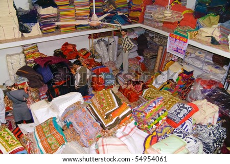 DELHI - DECEMBER 2: A customer shops in a textile warehouse intended for export on December 2, 2007 in Delhi, India. Textiles exports may touch $24 billion in 2010-11