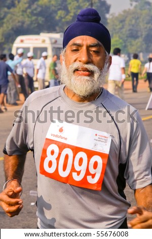 DELHI - OCTOBER 28: Elderly bearded Sikh man with turban competing in marathon on October 28, 2007 in Delhi, India. The 2009 event attracted around 29,000 runners from all walks of life.