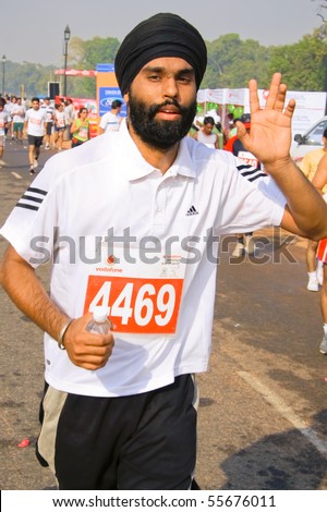DELHI - OCTOBER 28: Young bearded Sikh man with turban competing in marathon on October 28, 2007 in Delhi, India. The 2009 event attracted around 29,000 runners.