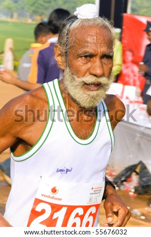 DELHI - OCTOBER 28: Elderly bearded Sikh man competing in marathon on October 28th, 2007 in Delhi, India. The 2009 event attracted around 29,000 runners.